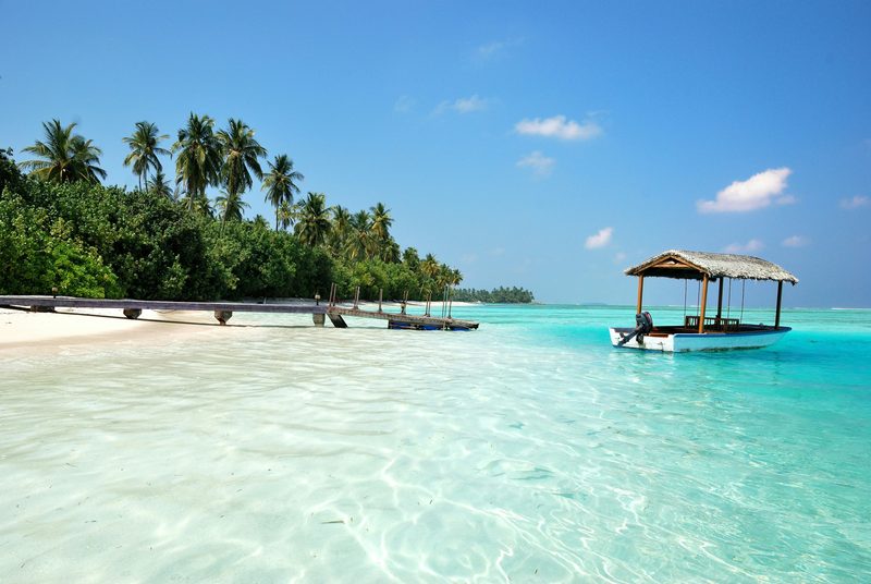 Crystal clear turquoise lagoon and white sand beach in the Maldives